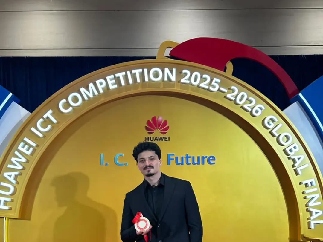 At the Huawei ICT Competition 2025-2026 Global Final backdrop in Shenzhen